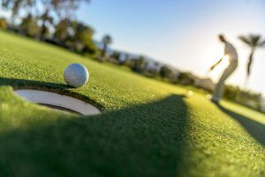 golfer near a hole