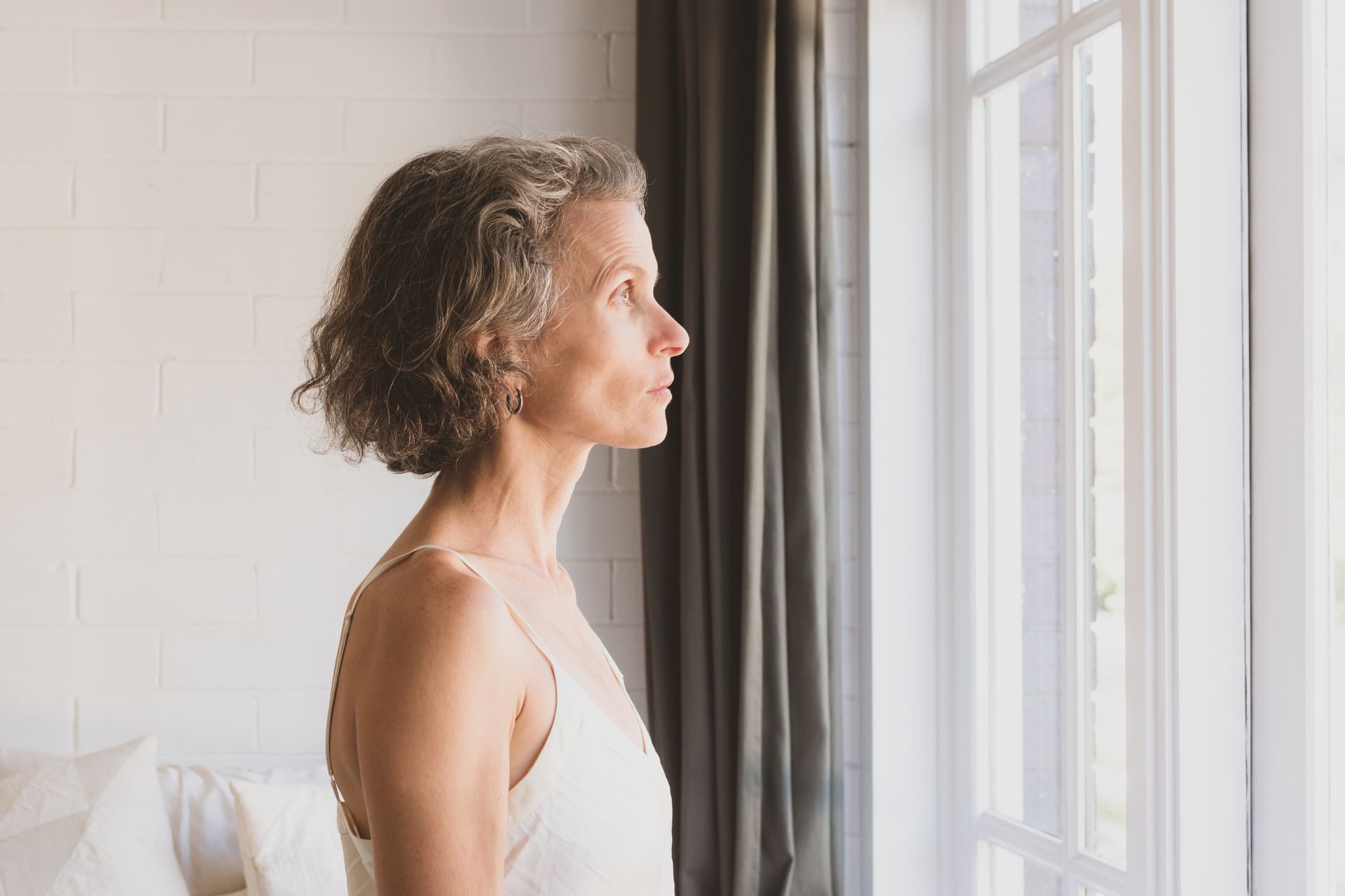 woman looking out the window